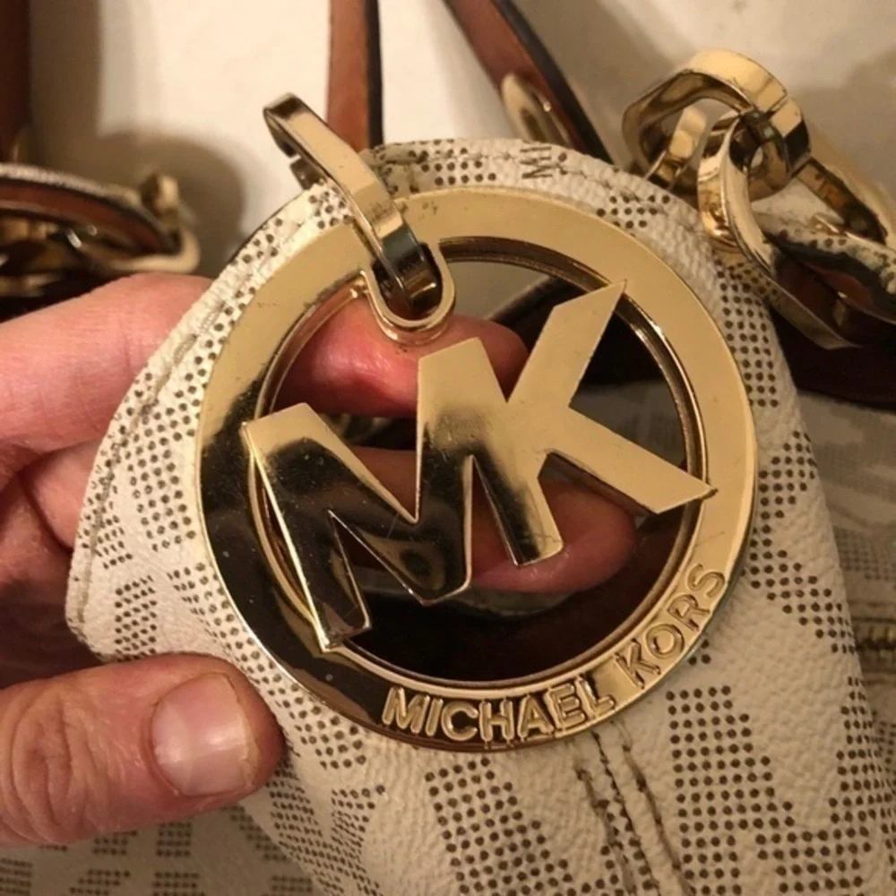 Michael kors white monogram triple compartment bag